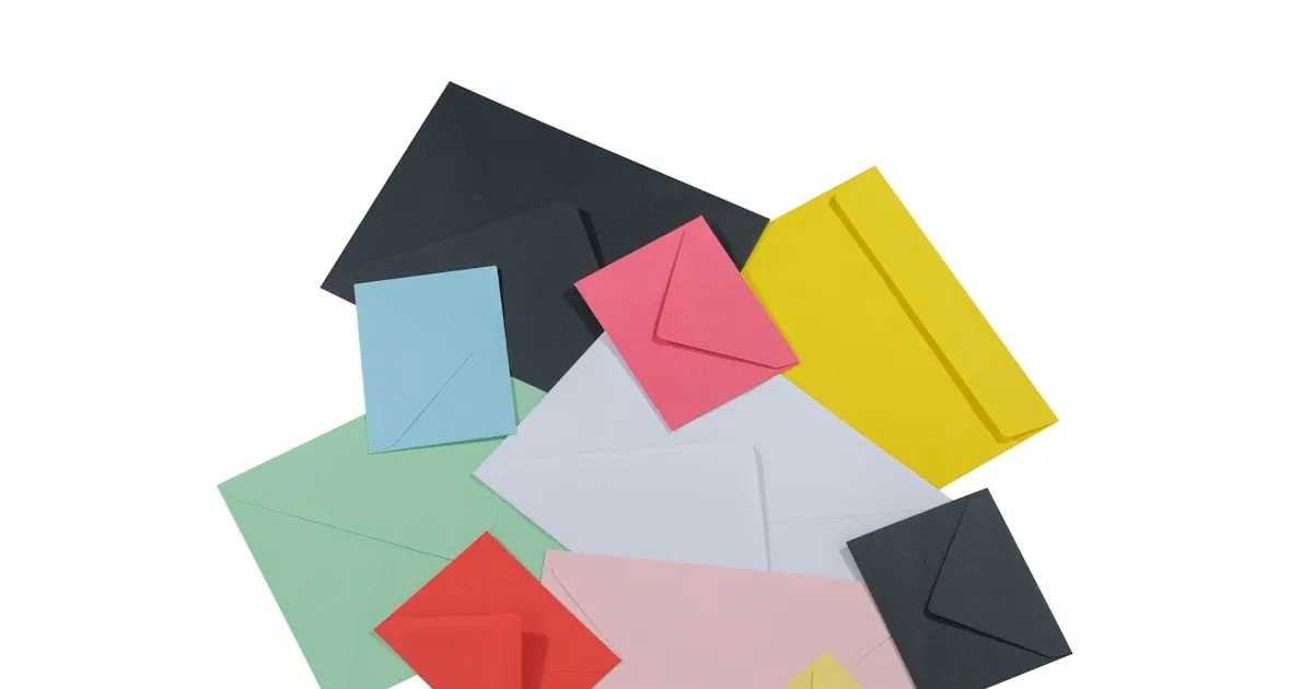 A pile of different colored envelopes