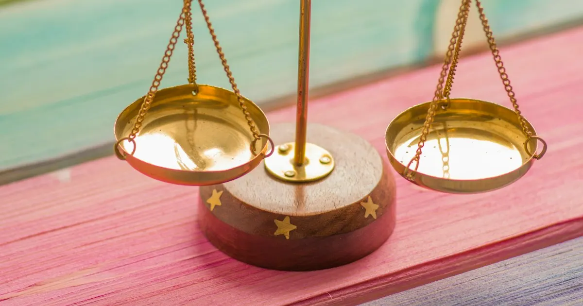 A small balance scale weighing two sides evenly